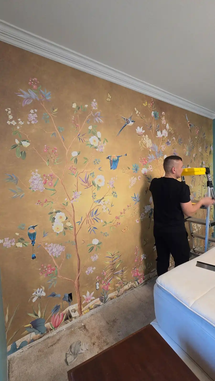 Professional wallpaper installation team at work